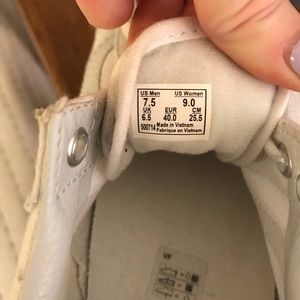 All white Old Skool Vans